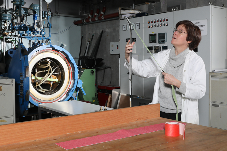 In the Laboratory for Processing of Advanced Composites, working on a project to develop novel skins for touring skis. (Image: Alain Herzog, EPFL.)